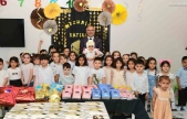 Miniklerin ilk karnesi Başkan Er'in elinden