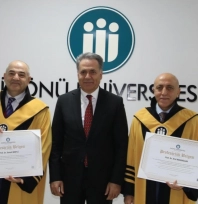 Unvanda yükselen akademisyenlere cübbeleri giydirildi